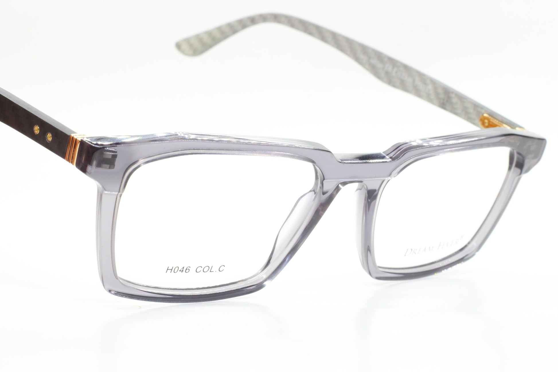 Clear and black Dream Fever designer eyeglass frames by ABC Optical with rectangular shape