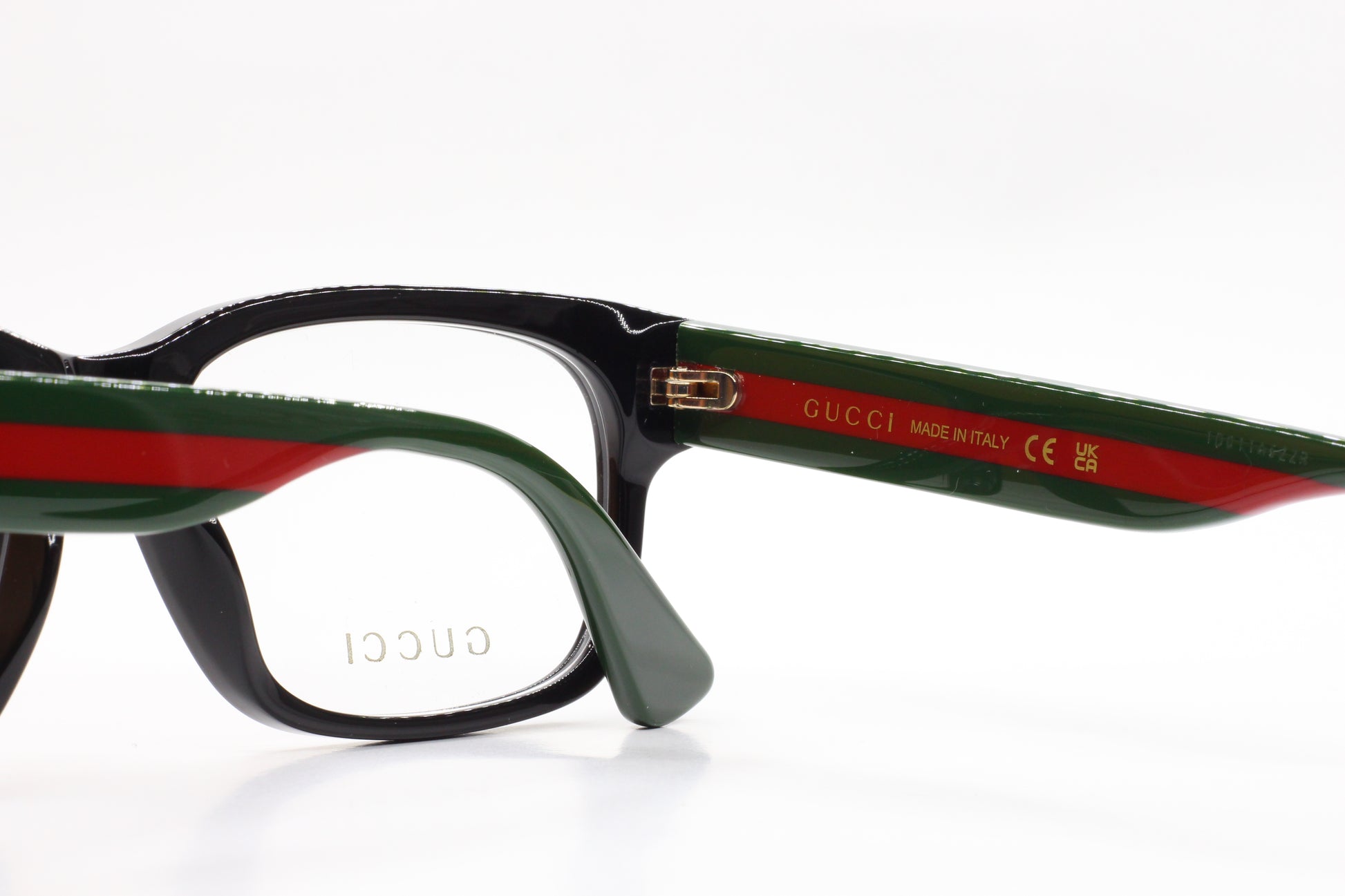 Gucci GG0343O 007 eyeglasses for sale with black frame and green red temple accents by ABC Optical