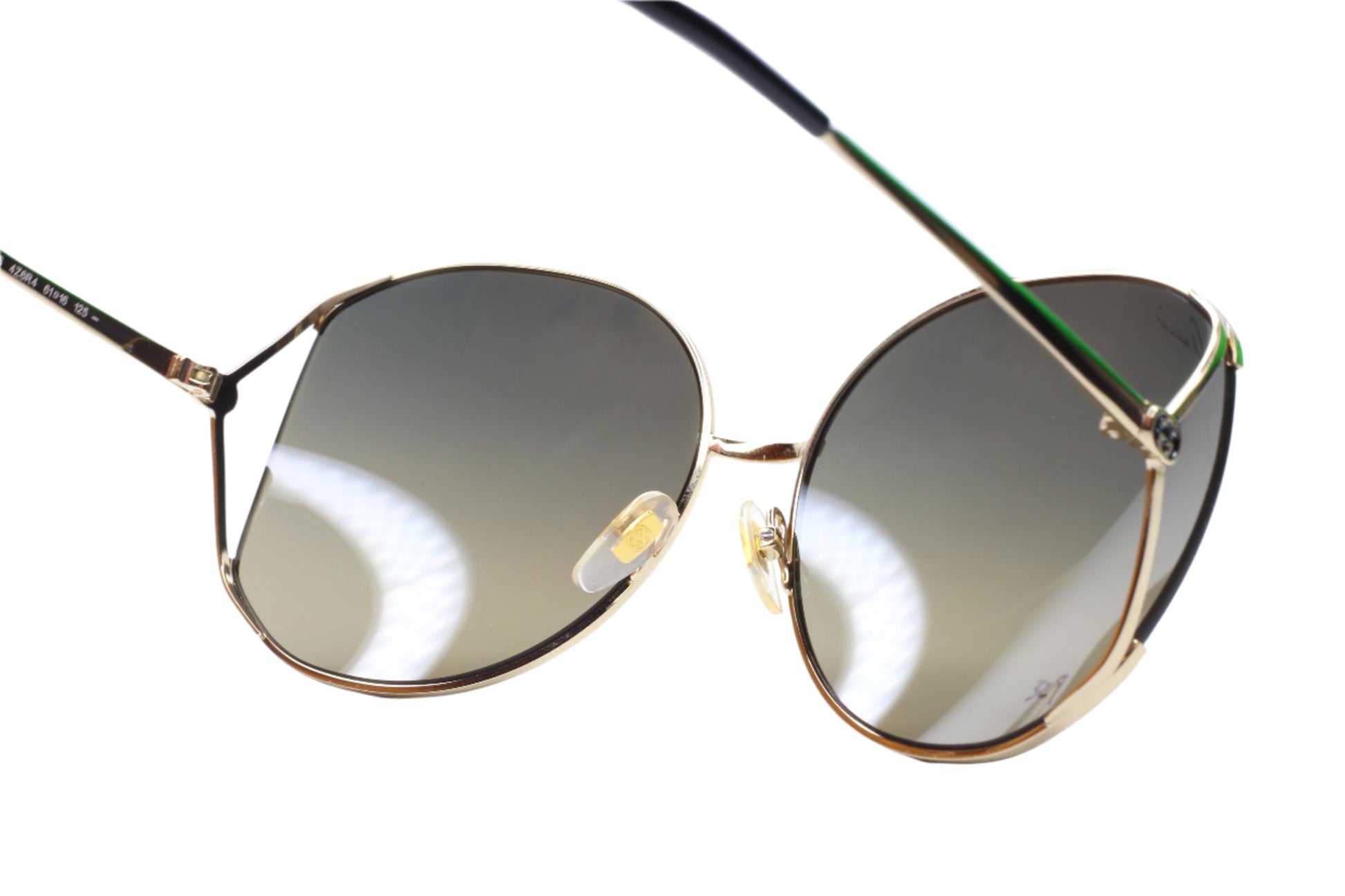 Gucci gold metal sunglasses women with tinted lenses and lightweight frame by ABC Optical