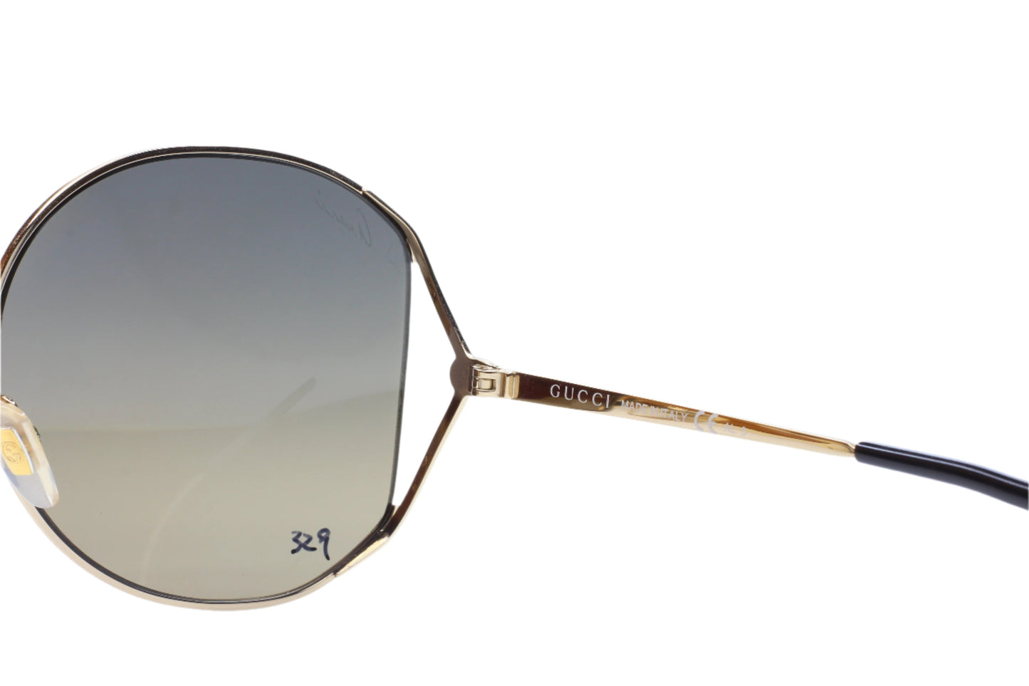 Gucci gold metal sunglasses women with round gradient lenses and thin frame from ABC Optical