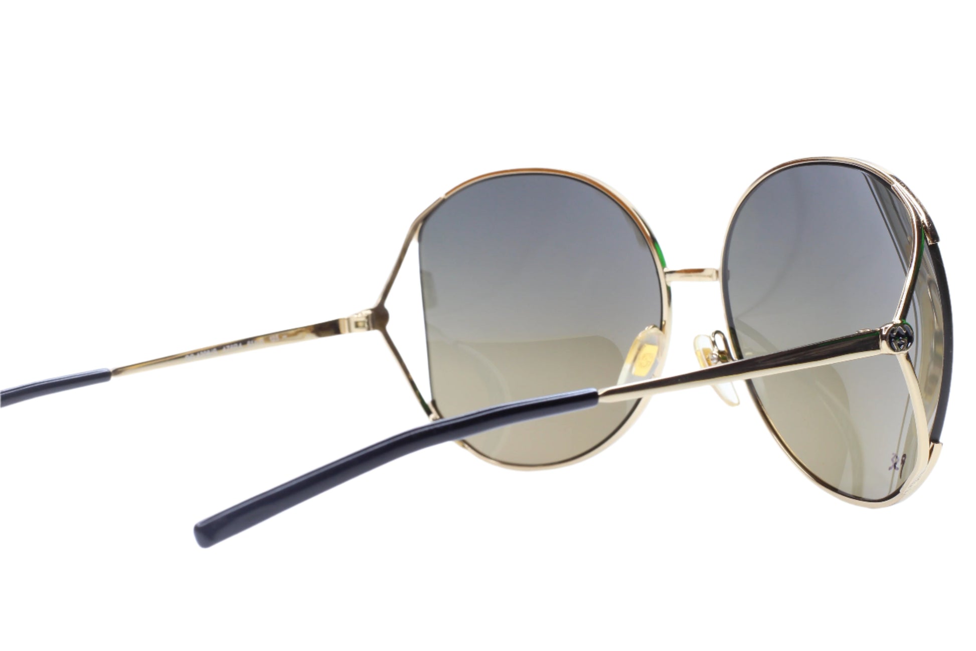 Gucci gold metal sunglasses women with round gradient lenses and slim temples from ABC Optical