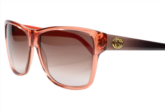 Gucci light rose crystal sunglasses with gradient lenses and gold logo on temple by ABC Optical