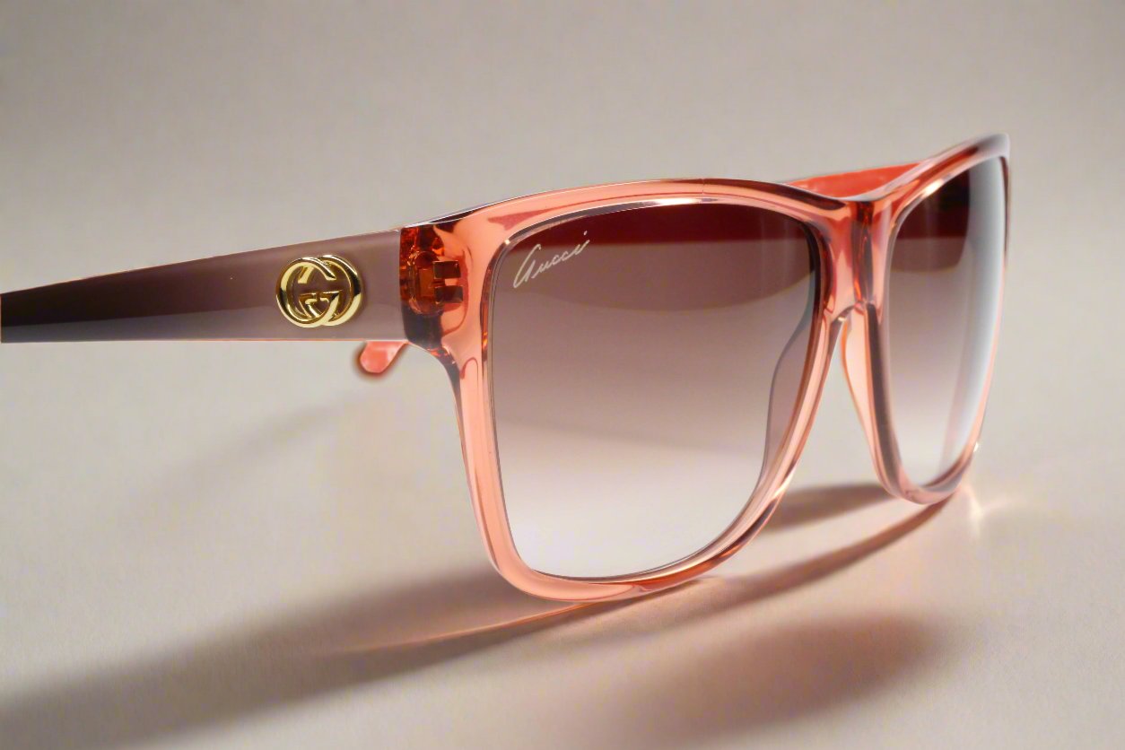 Gucci light rose crystal sunglasses with gradient lenses and gold logo on the temple by ABC Optical