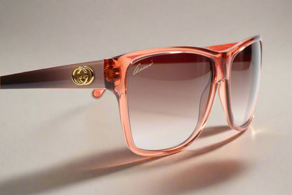 Gucci light rose crystal sunglasses with gradient lenses and gold logo on the temple by ABC Optical