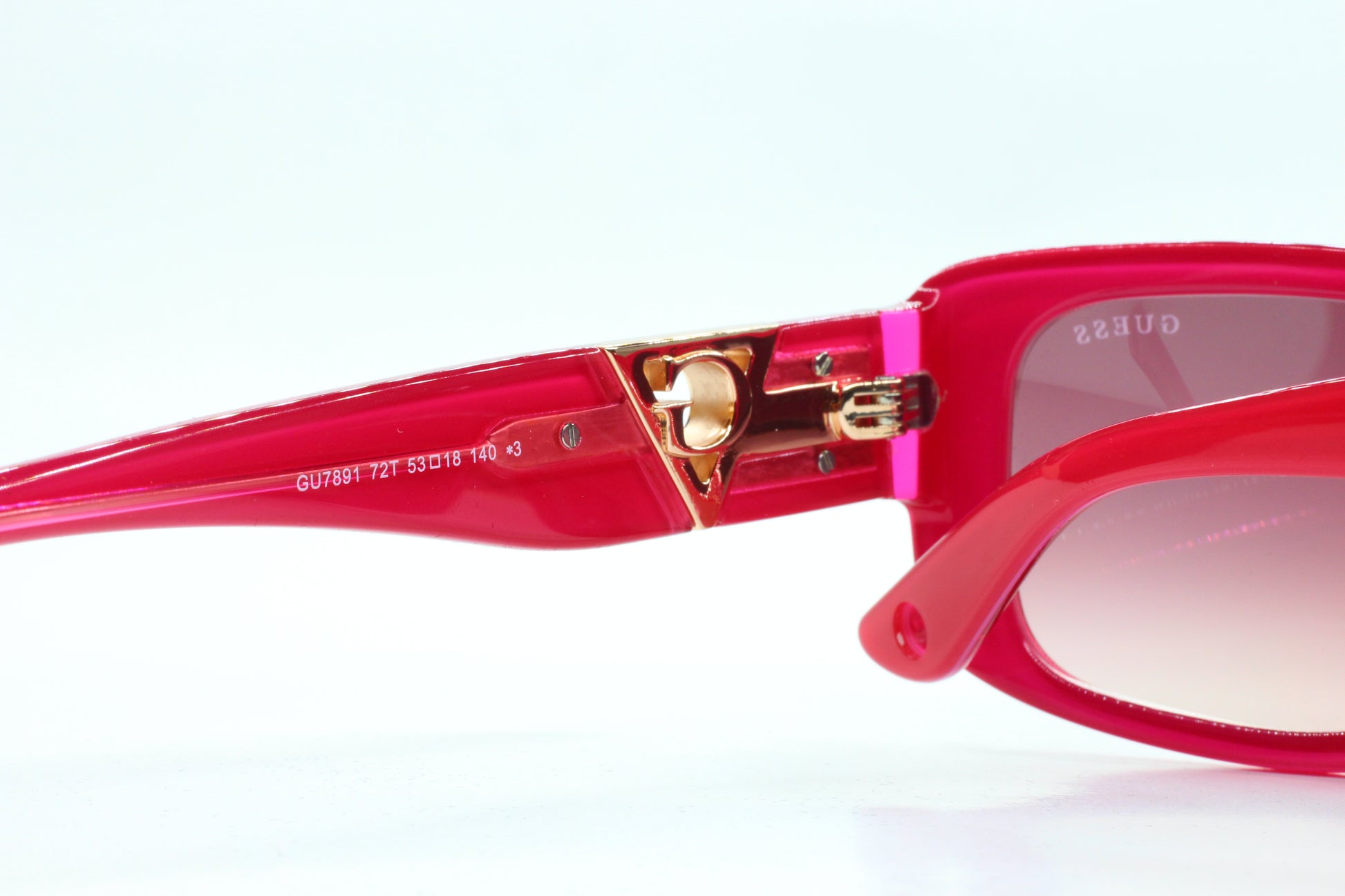 Guess pink gold sunglasses women optical frames by ABC Optical in glossy pink with gold hinge details