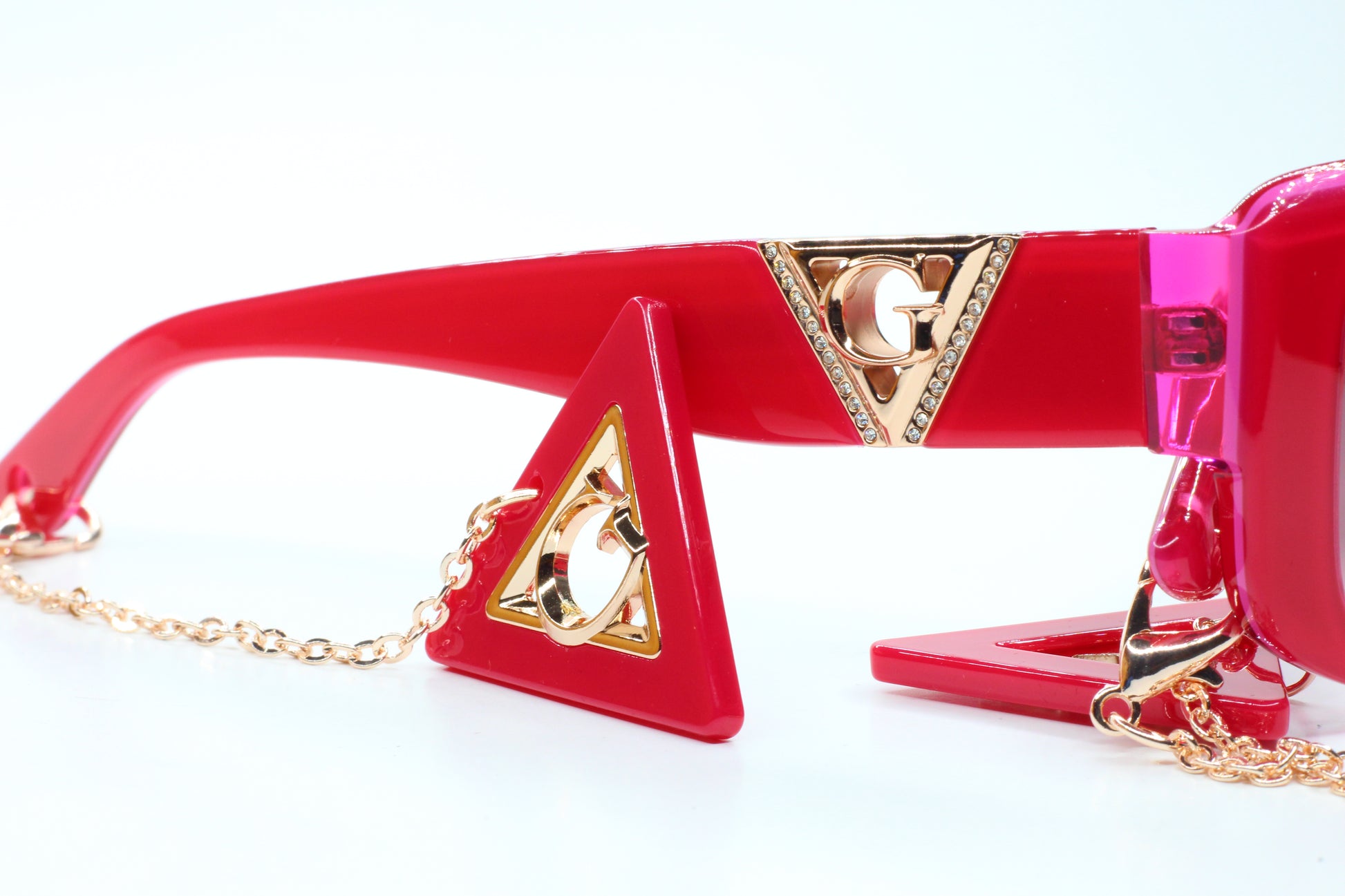Guess pink gold sunglasses women with red frame and gold logo details by ABC Optical