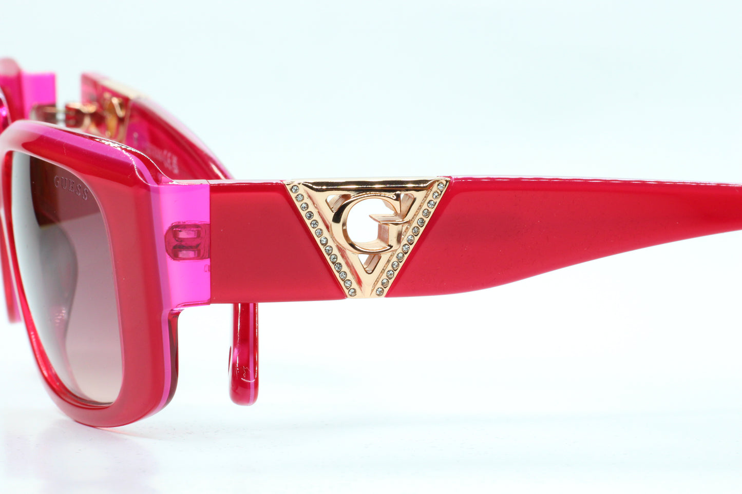 Guess pink gold sunglasses women in vibrant pink frame with gold logo detail from ABC Optical
