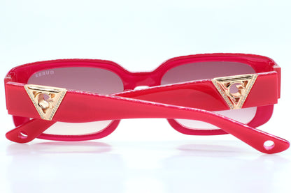 Guess pink gold sunglasses women by ABC Optical with pink frames and gold triangle accents