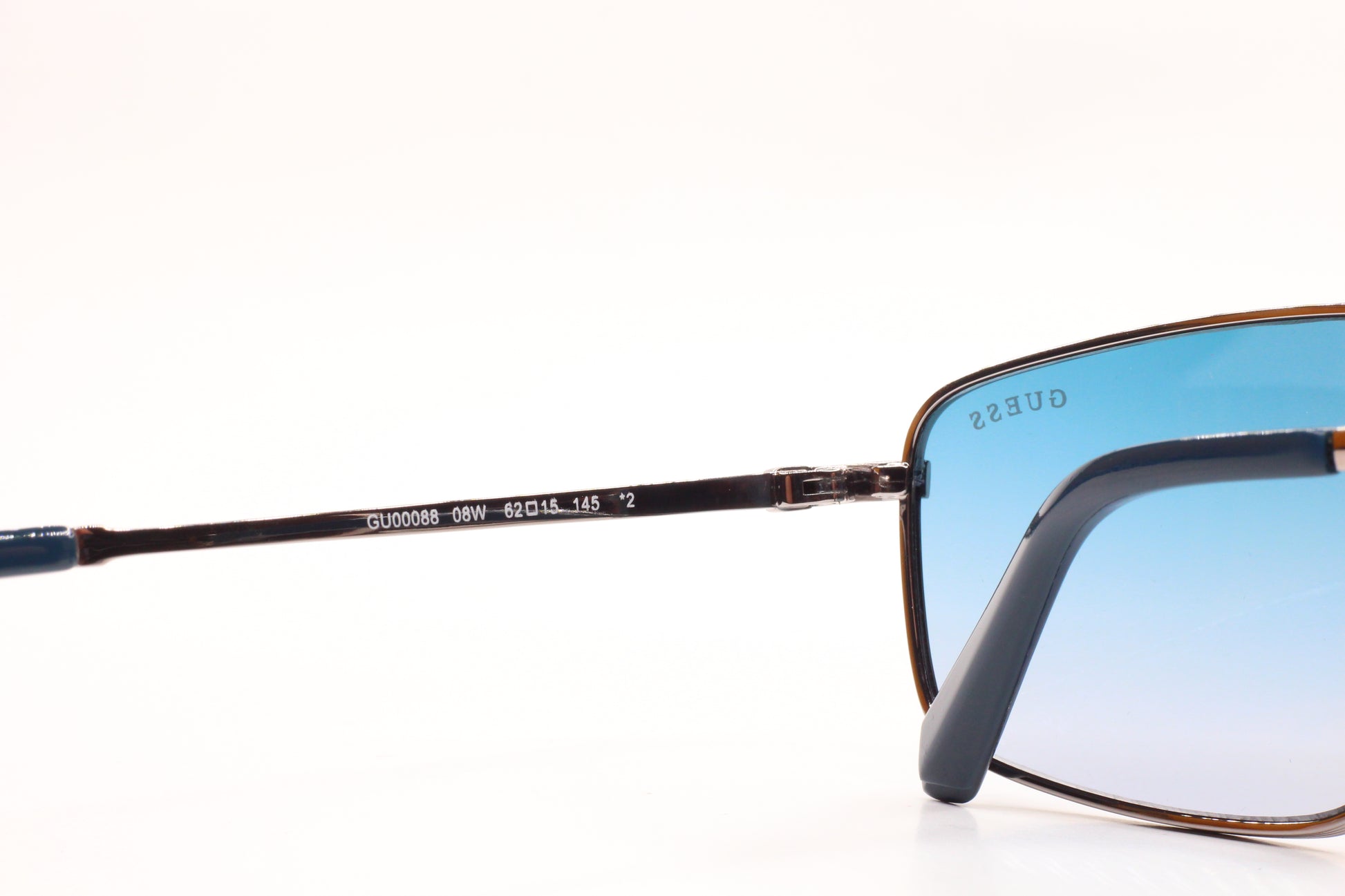 Guess silver blue gradient sunglasses optical frames by ABC Optical with sleek metal design