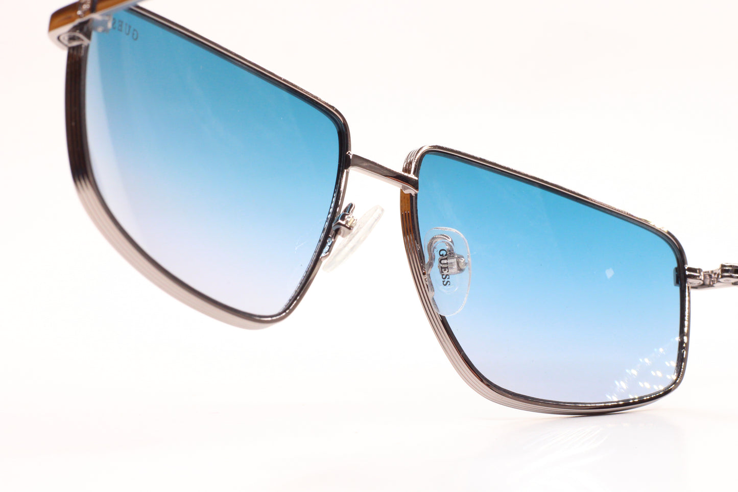 Guess silver blue gradient sunglasses featuring sleek metal optical frames by ABC Optical