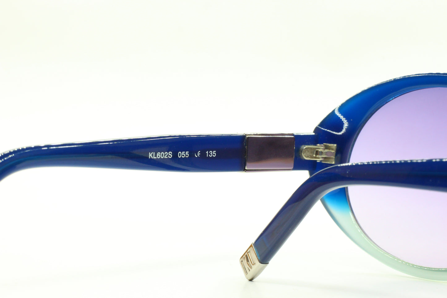 Close-up of ABC Optical Karl Lagerfeld blue gradient sunglasses frame showing hinge and temple details