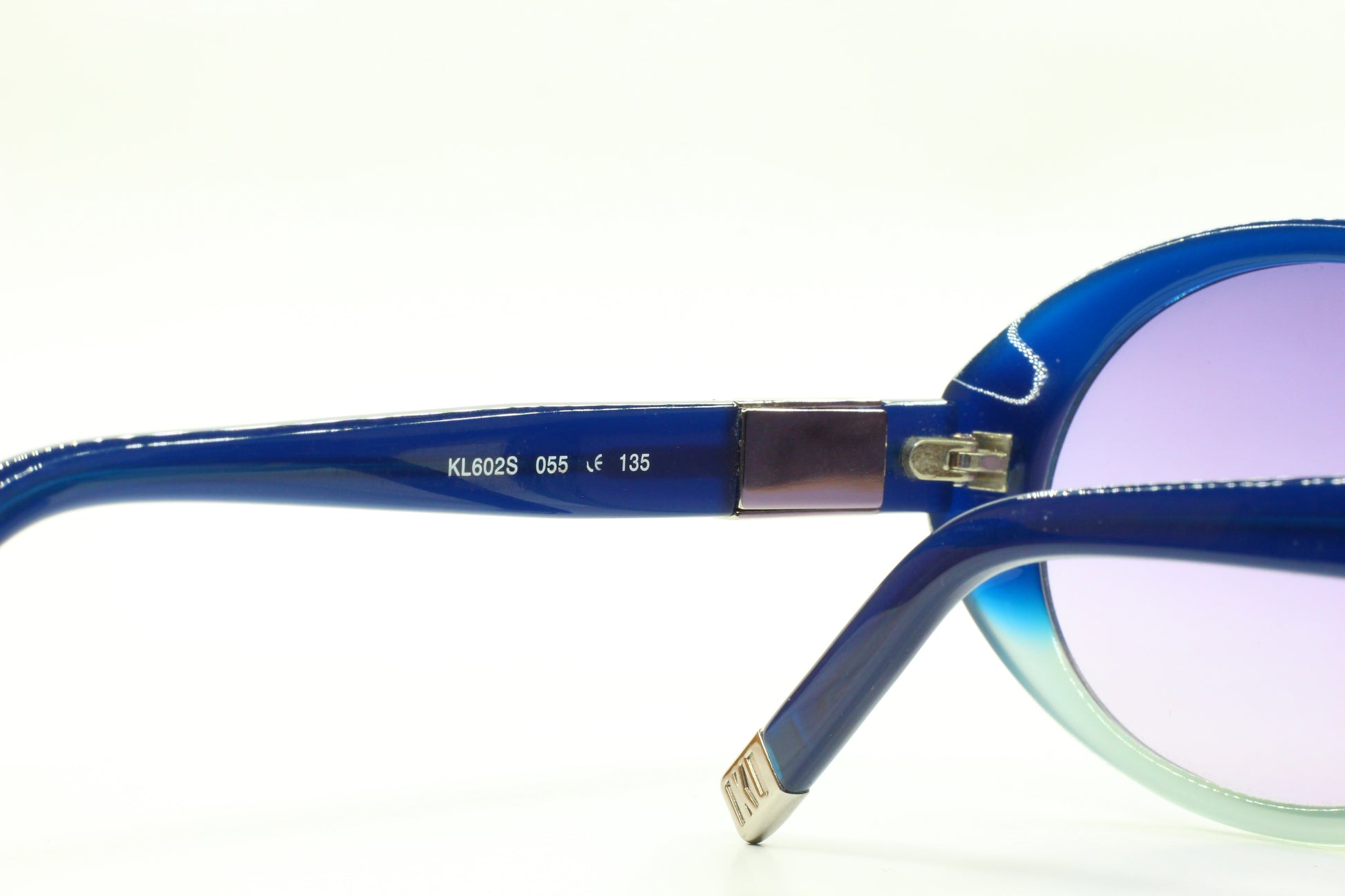 Close-up of ABC Optical Karl Lagerfeld blue gradient sunglasses frame showing hinge and temple details