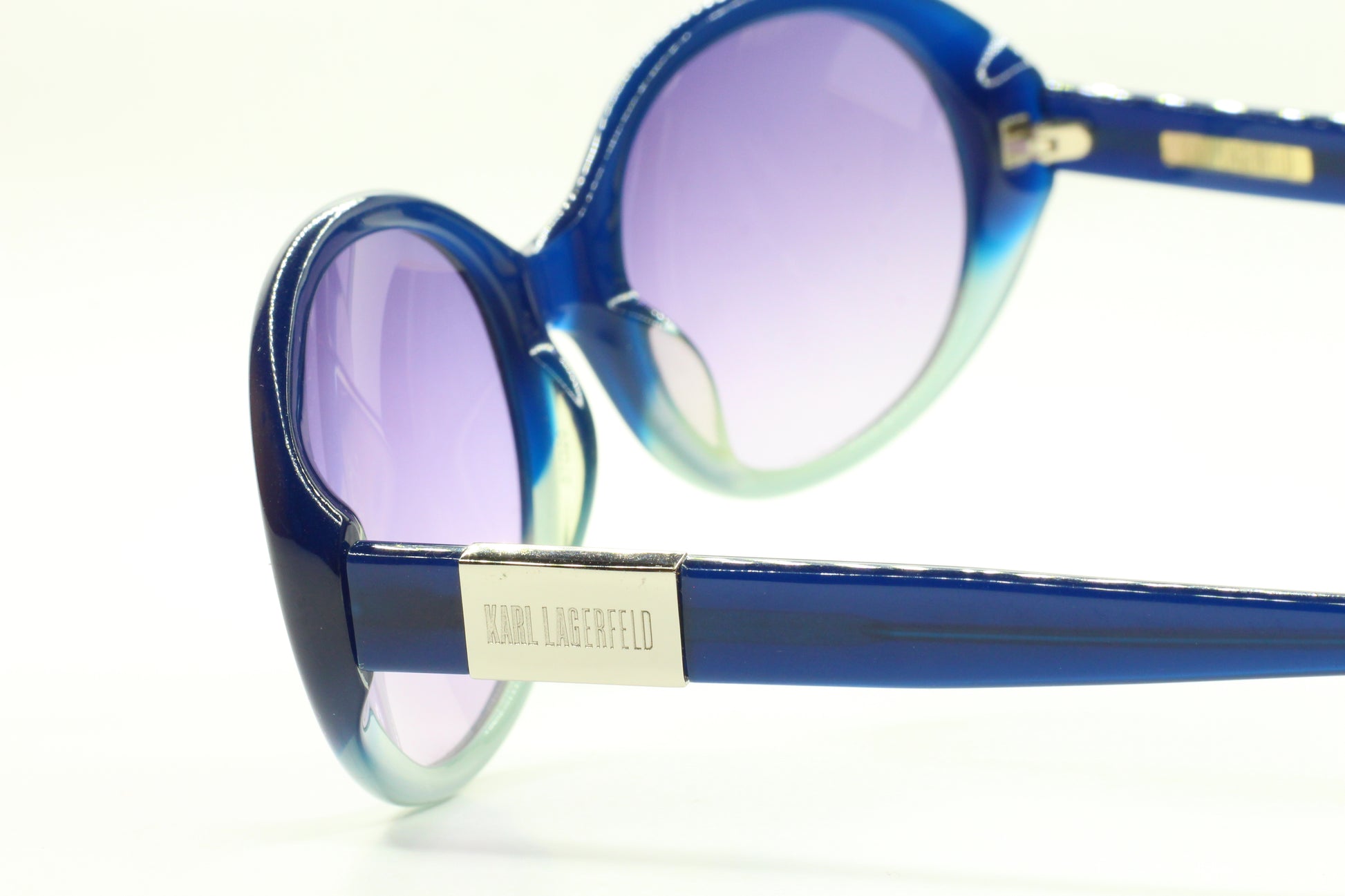 Karl Lagerfeld blue gradient sunglasses with round lenses and glossy blue frames by ABC Optical