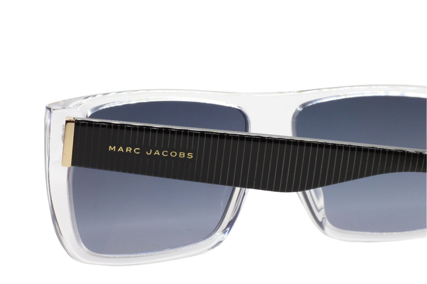 Marc Jacobs luxury clear frame sunglasses with black striped temples and dark lenses