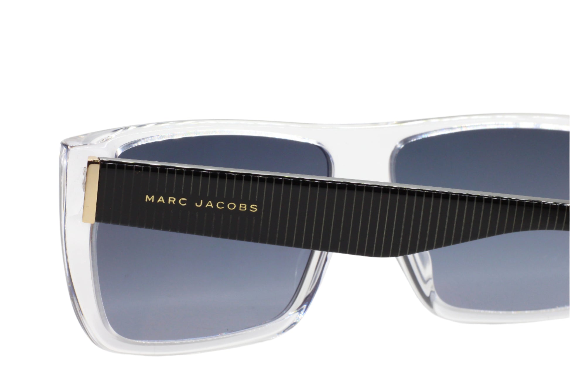 Marc Jacobs luxury clear frame sunglasses with black striped temples and dark lenses