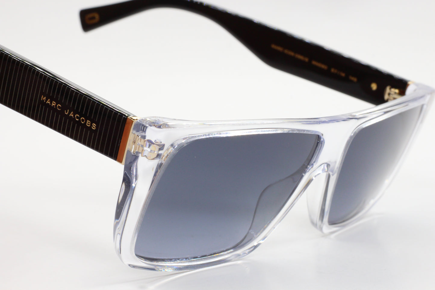 Luxury clear frame sunglasses with black temples and gradient lenses from ABC Optical