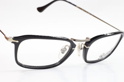 Black Persol PO3044V eyeglasses with metal bridge and adjustable nose pads by ABC Optical