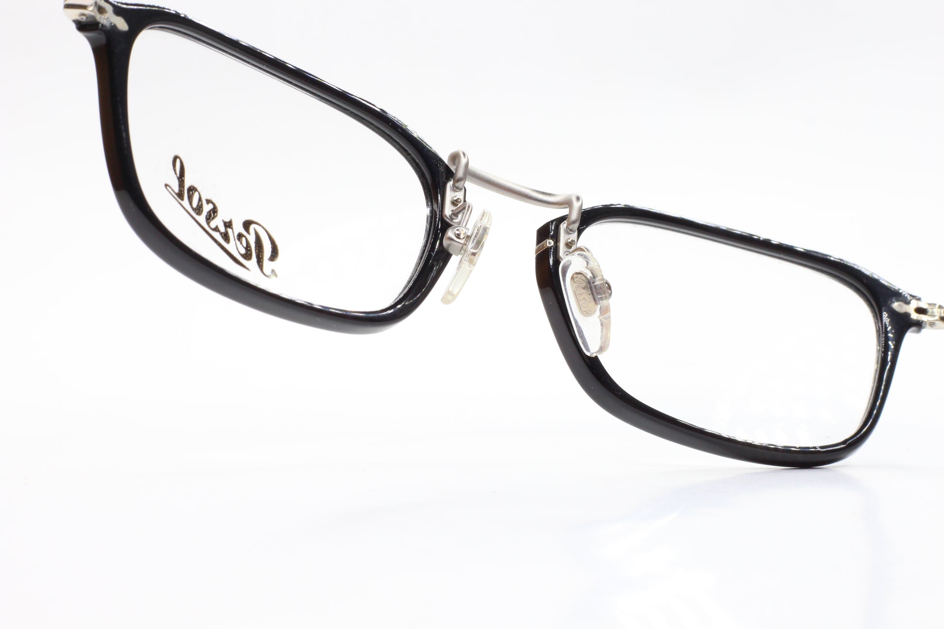 Close-up of Persol PO3044V eyeglasses with black rectangular frames by ABC Optical