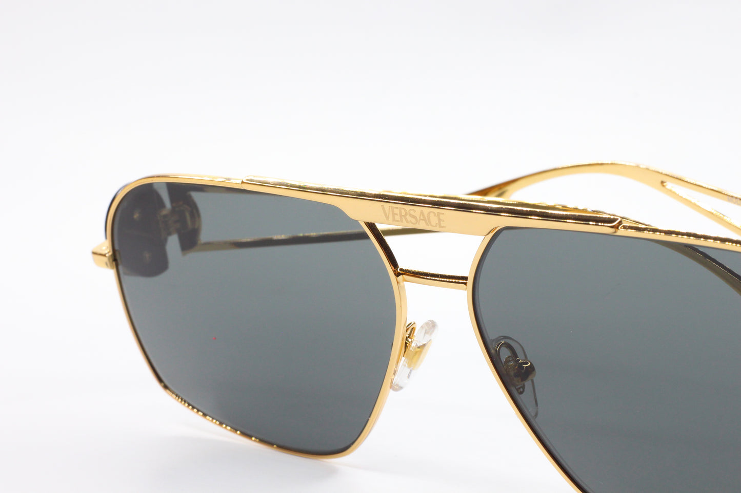 Luxury Italian designer sunglasses with gold-tone metal frames by ABC Optical