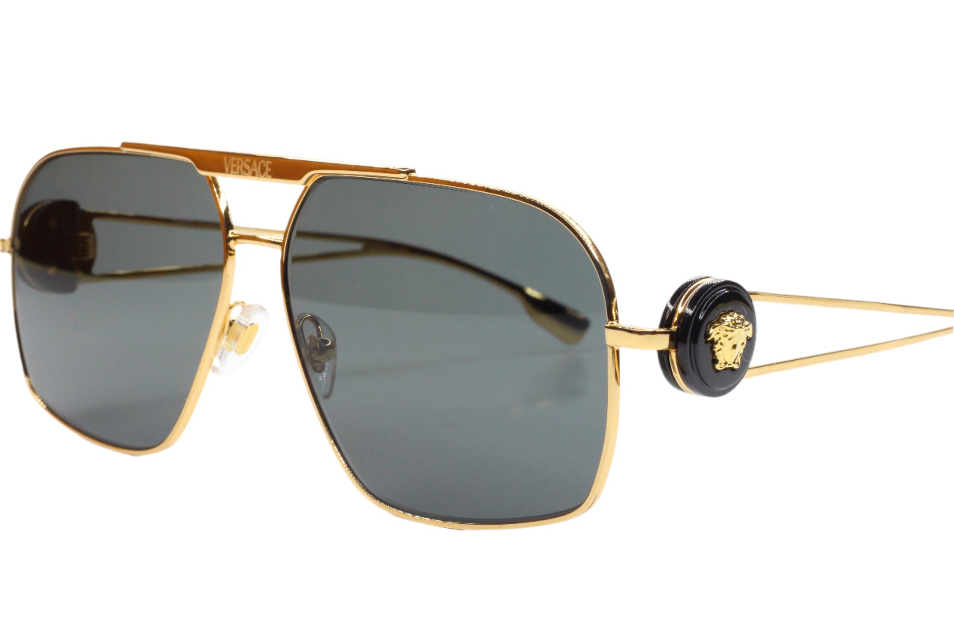 Luxury Italian designer sunglasses by ABC Optical featuring gold frames and dark lenses