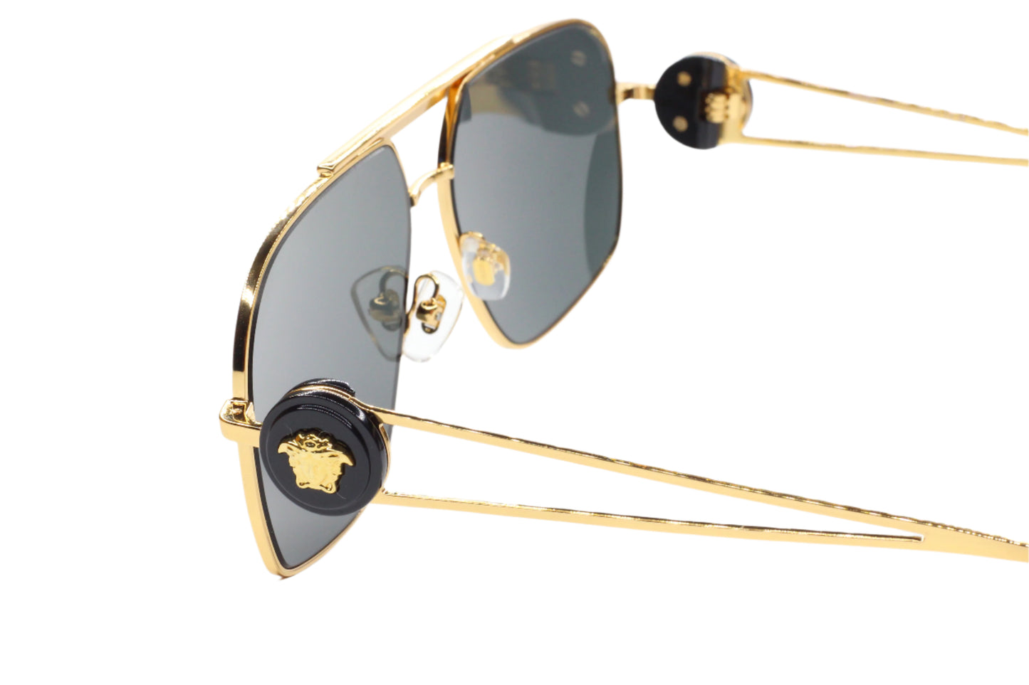 Luxury Italian designer sunglasses with gold frame and black logo detailing by ABC Optical