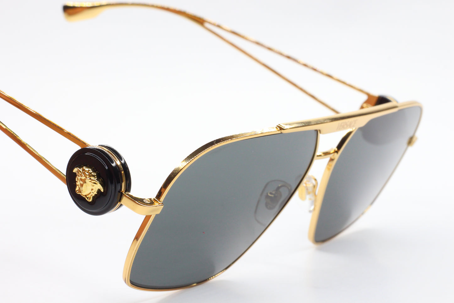 ABC Optical luxury Italian designer sunglasses with gold frame and dark lenses